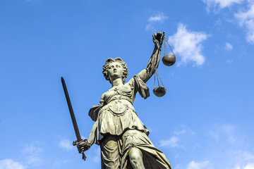 Justitia (Lady Justice) sculpture on the Roemerberg square in Fr