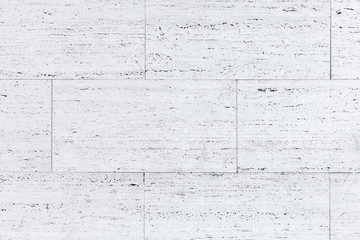 White blocks of stone wall, closeup background photo texture