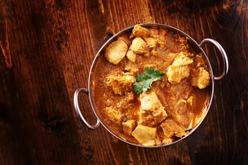 Printed kitchen splashbacks meal dishes overhead photo of a batli dish with indian butter chicken curry