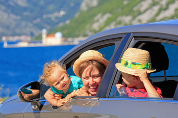 Fototapeta na wymiar mother with kids travel by car at the sea