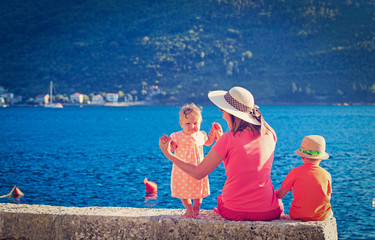 mother with kids on sea vacation
