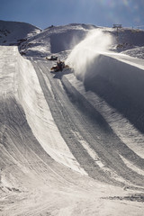 Halfpipe of Kitzsteinhorn ski resort in Austria with grooming ma