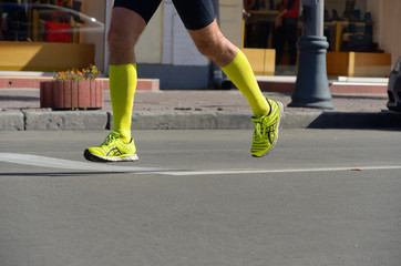 Running concept, man's legs run in sport shoes