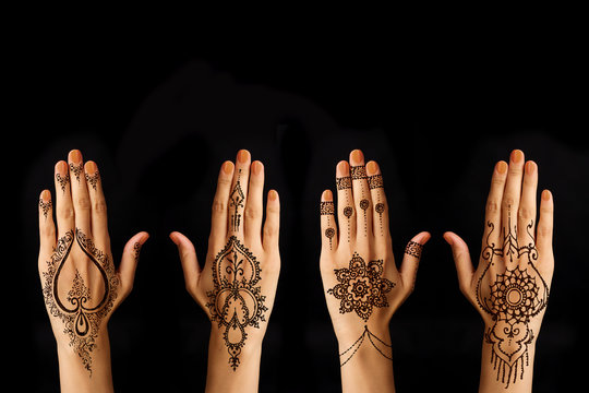 Hand With Mehendi On Black Background