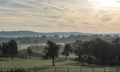 sunrise in the hills of belgium