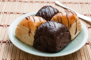Freshly baked two- color bread loaf with cup of coffee