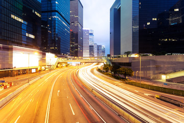 Fototapeta na wymiar modern city urban traffic light trails and business buildings