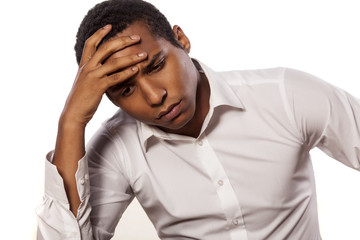 desperate african businessman on white background