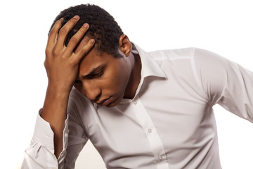 desperate african businessman on white background
