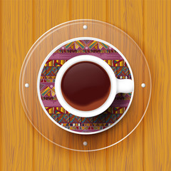 Cup of coffee on a saucer with Tribal texture. Vector illustrati