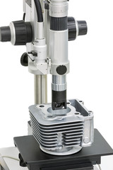 Fototapeta na wymiar operator inspection machining surface of body cylinder by micros