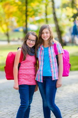 Teenage schoolgirls with schoolbag
