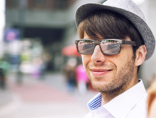 Portrait of a handsome young man with sunglasses