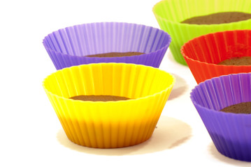Chocolate muffins in silicone holders of many colors