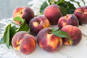 Fresh peaches on wooden table