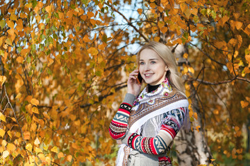 Portrait of a beautiful young woman calling by phone