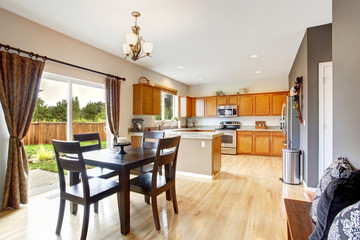 American house interior with open floor plan. Kitchen room and d