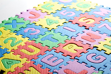 Multicolored plastic toy letters spelling the word Autism