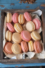 French macarons in a wooden box, selective focus