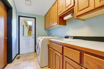 Laundry area with exit to backyard