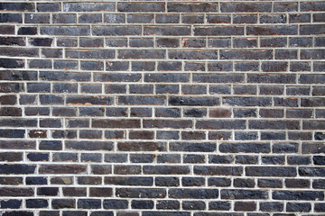 Weathered old brick wall with white insert