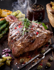 Delicious beef steak on stone table, close-up