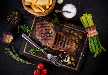 Delicious beef steak on stone table, close-up