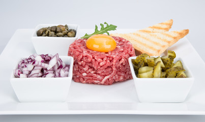 fresh beef tartar with egg, close-up.