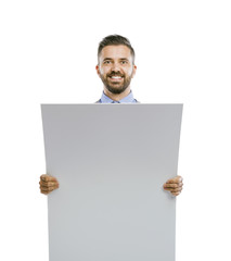 Hipster businessman with blank advertisement