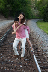 Obraz premium Romantic Asian couple playing outside