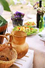 Buffet table with dishware waiting for guests