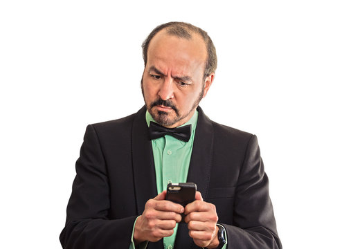 puzzled confused business man looking at smartphone