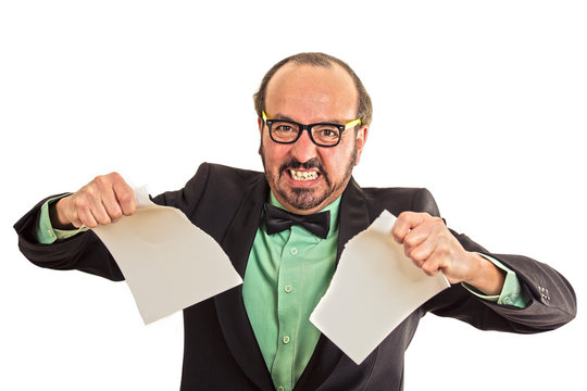 angry businessman tearing a document to pieces