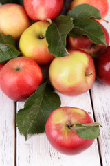 Ripe red apples on wooden background