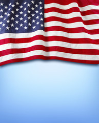 American flag on blue background. Copy space