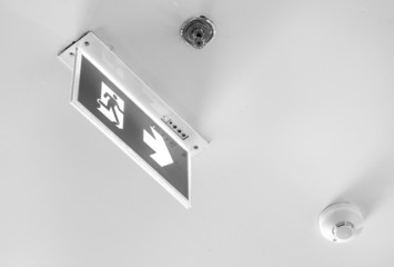 Emergency exit sign, cube light on ceiling, concept  by monochro