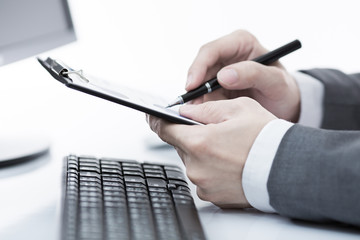 Businessman analyzing investment charts with computer. Accountin