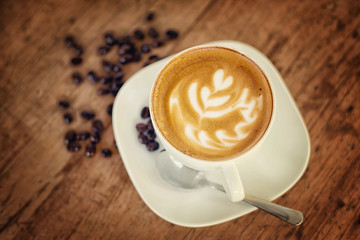 Cup of art latte or cappuccino coffee