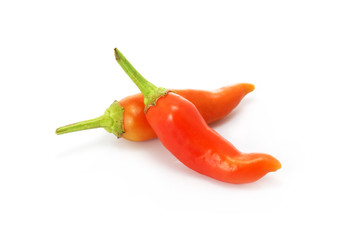 A pile of chilli peppers on a white background