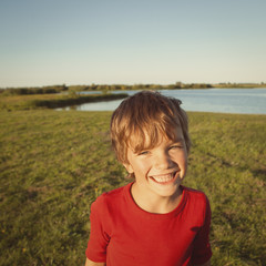 Portrait happy boy in red sweater,