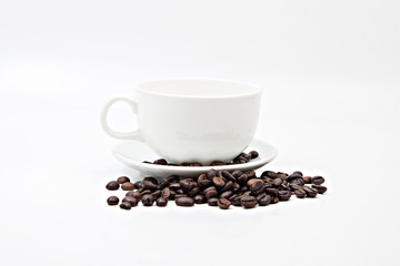 Brown coffee beans and coffee cup isolated on white background
