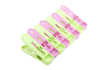 Plastic clothes pegs isolated on white