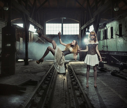Two witches in the old and empty railway station