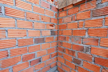 Obraz na płótnie Canvas brick wall in residential building construction site
