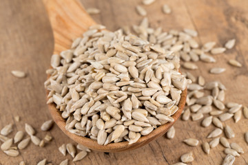 sunflower seeds in a wooden spoon
