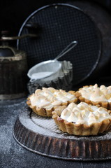 Tarts with cherry and meringue, selective focus