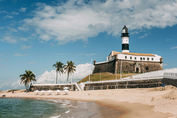 Morning on the beach near Barra lighthouse in Salvador, Brazil. - obrazy, fototapety, plakaty