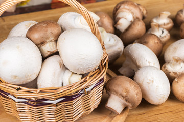 white and brown mushrooms in a basket