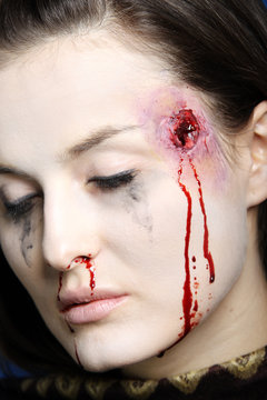 Portrait of a woman shot in the head.