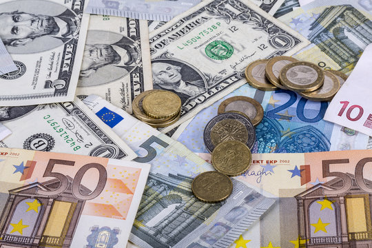 banknotes and euro coins and dollar